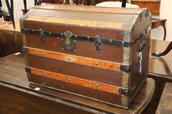 A Victorian wood bound domed trunk W.72cm